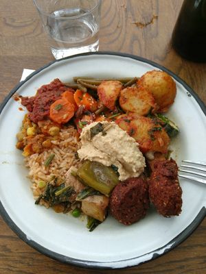 Buffet plate with tofu stew, falafel, salads and dips at Sandro in Helsinki