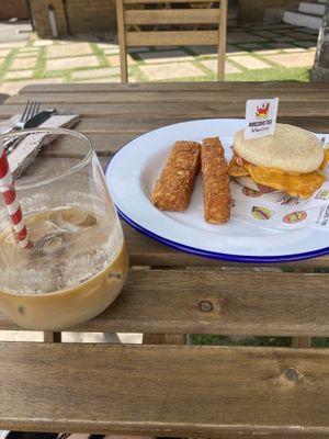 mighty muff with tofu egg, bacon and baconnaise - hash browns come with - iced latte  at Mighty Wieners  in Bournemouth