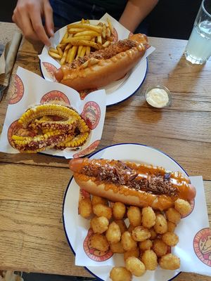 Dirty wiener with fries, cali wiener with tots and corn ribs at Mighty Wieners  in Bournemouth