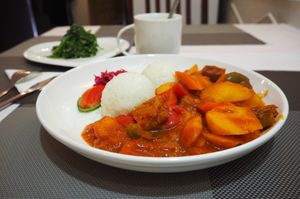 goulash with spinach salad and ginger tea at Bilig Vegan Bistro in Ulaanbaatar