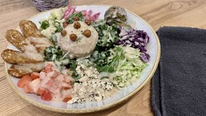 Mediterranean bowl with tempeh and greens added on  at Kind Cafe in Vancouver