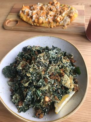 Kale Caesar salad and buffalo cauliflower flat bread :) at Kind Cafe in Vancouver