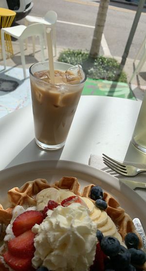 Sweet waffle and iced latte. They have a savory waffle too.  at Project Coffee - Burns Court in Sarasota