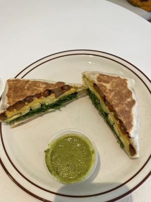 Burrito with vegan egg, vegan cheese, potatoes, avocado, lettuce, sauce  at Project Coffee - Burns Court in Sarasota