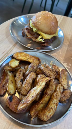 Two handed sandwich and home fries   at Project Coffee - Burns Court in Sarasota