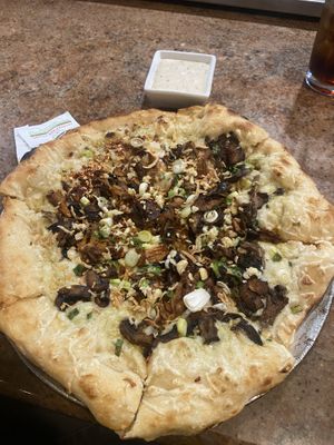 South county pizza! Wild mushroom medley, garlic, fried shallots, green onions, on a white sauce base!  at Craft Roots  in Morgan Hill
