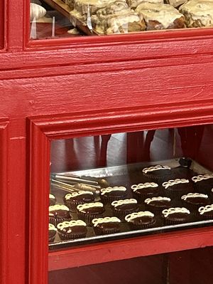 Cinnamon rolls and hostessy looking dudes. I resisted the temptation.    at SweetArt in St Louis