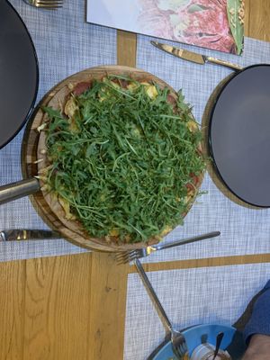 Malty pizza with smoked seitan, vegan sausages, and vegetables  at Fenkhel Fennel in Kyiv