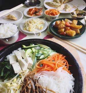 Vege hot stone bowl bibimbap no egg and banchan (side dishes) and mandu (fried veggie dumplings) at Koja Cuisine in Easton