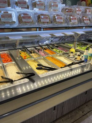 salad bar with vegan protein, cheeses & dressings  at Whole Foods Market - University Ave in San Diego