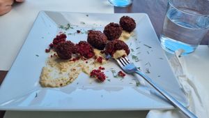 Tomato balls on hummus at Let's Vegan in Crete