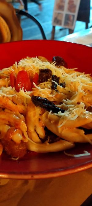 Local handmade pasta dish with wholewheat flour, vegan cheese, sundried tomatoes at Let's Vegan in Crete