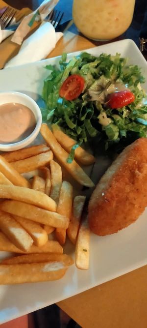 Vegan chicken fillet filled with a lanvender sauce, salad and fries at Let's Vegan in Crete
