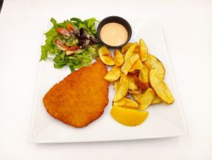 PLANT BASED SCHNITZEL WITH MAJO AND FRESH POTATOES at Let's Vegan in Crete