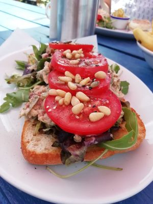 Chickpea by the Sea - chickpea mash and salad served on toasted ciabatta, topped with tomatoes, pine nuts, and a generous drizzle of olive oil at Old Town Beach Cafe  in Hunstanton