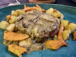 Vegan steak with porcini mushrooms, potatoes, and roasted pumpkin.  at Munz Munz in Monopoli