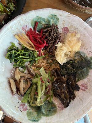 Veggies into my own bowl, sesame oil in the middle. No gochujang needed, already so flavorful  at Jeombongsan Sanchae in Sokcho