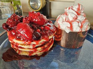 Vegan pancakes with mixed berries, plum sauce and cream at Off The Rails in Yarmouth