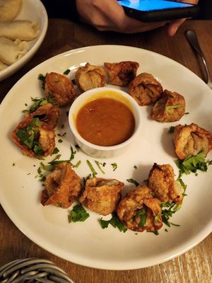 Fried pierogi with asian flavors and mango sauce at Pierogarnia Mandu Centrum in Gdansk