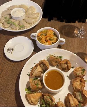(Left to right) cabbage & mushroom pierogies, kimchi salad, fried vegan pierogies   at Pierogarnia Mandu Centrum in Gdansk
