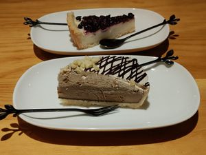 Coffee ice cream pie and blueberry cheesecake behind it at Loving Hut - Heping Branch in Taipei