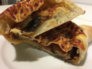 Vegan calzone with cherry tomatoes and eggplant (take away) at Trigo in Barcelona