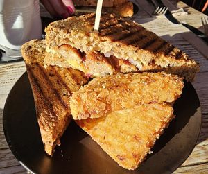 Sausage, red onion, smoked cheese & mustard mayo toastie with hash browns at PEACH in Newport