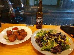 Chicken nuggets and pesto salad at Kind Kitchen in Porto