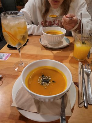 Vegetable soup of the day: pumpkin. Drink is the porto tónico. at Kind Kitchen in Porto