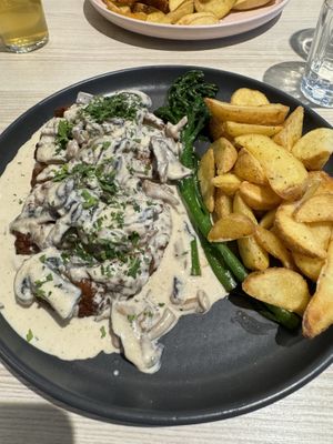 Seitan steak with mushrooms and gravy and fries  at Kind Kitchen in Porto