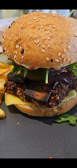 Overcooked Seitan and Bacon burger at Kind Kitchen in Porto