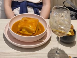 Francesinha with fries at Kind Kitchen in Porto