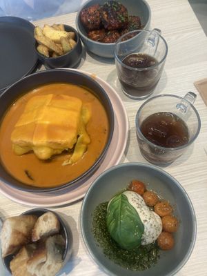 Francesinha on the left, nuggets at the top, burata at the bottom   at Kind Kitchen in Porto