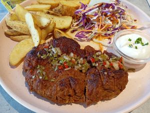 Seitan caseiro com molho chimichurri at Kind Kitchen in Porto