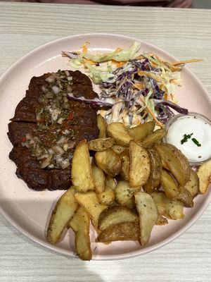 Chimichurri seitan steak with coleslaw and steak   at Kind Kitchen in Porto
