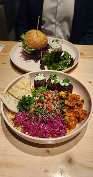 Middle East bowl and black bean mushroom burger on sourdough bun. at Kind Kitchen in Porto