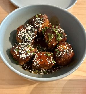 Tofu bites as starter, great sauce, crispy outside and quiet big!  at Kind Kitchen in Porto