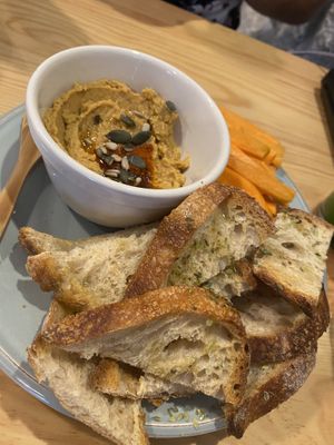 Hummus, sourdough and carrot sticks x at Kind Kitchen in Porto