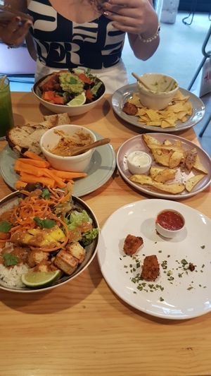 From bottom to top: Thai budda bowl and nuggets, hummus with dips and chips, guacamole with nachos and Mexican budda bowl at Kind Kitchen in Porto