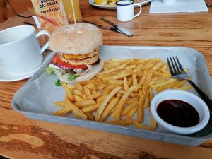Sweet potato and chickpea burger with fries.... That's my Nordic oat milk at The Station House in Warrington