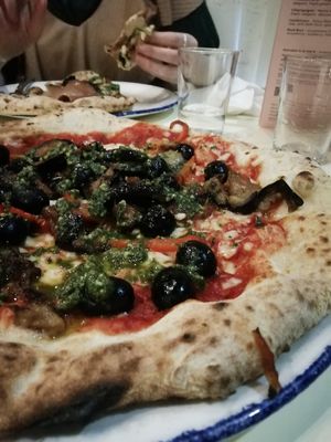 Roasted aubergine and peppers, black olives, vegan cheese, vegan pesto at PLY in Manchester