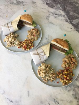 Burger, vegan döner wrap, quinoa salad, chickpea salad and pasta with tahini sauce at Good Call in Bursa