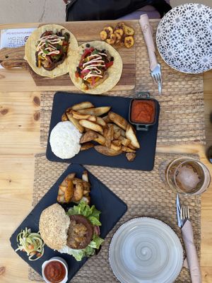 Vegan hamburger, patatas bravas and tacos  at Cafè Saüc in Mallorca