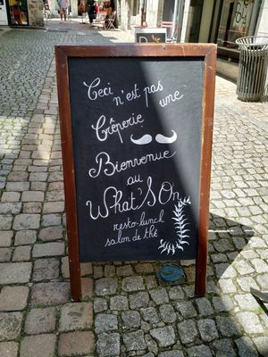 the sign outside at What's On in Quimper