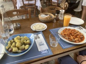 Antiparos salad (like Greek salad but with potatoes instead of cheese), garlic spread and gigantes beans  at Argo in Antiparos