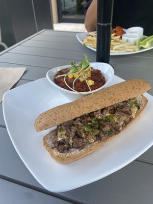 Cheesesteak with GF bun. Side of chili  at Green Culture in New Port Richey