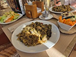 Vegan paella, salad, and hummus at Suc de Lluna BioCafe in Valencia