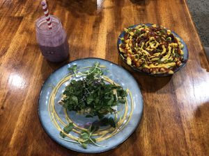 Mixed berry smoothie, mush fu & loaded fries at The Healthy Hub Cafe in Cairns