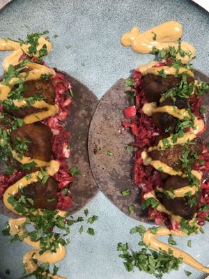 Buffalo Wing Tacos! Made with twice baked cauliflower, smokey beetroot slaw, chipotle mayo and fresh cilantro! at The Healthy Hub Cafe in Cairns