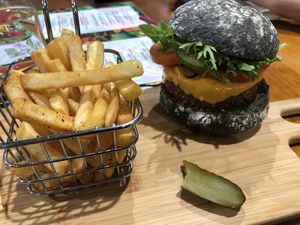 Beyond burger with charcoal bun at The Healthy Hub Cafe in Cairns